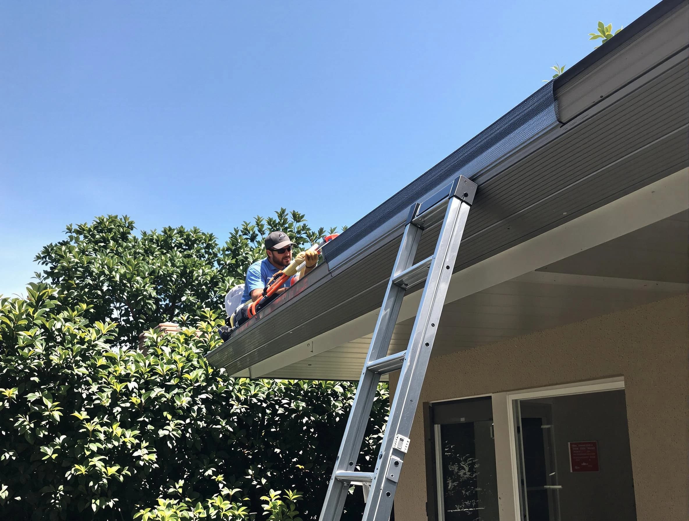 Rocky River Roofing Company installing gutter guards for a homeowner in Rocky River, OH